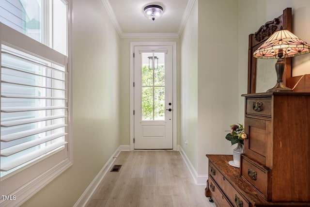 83 Vandalia Ave, Chapel Hill, NC 27516 - doorway featuring baseboards, light wood-style flooring, visible vents, and ornamental molding
