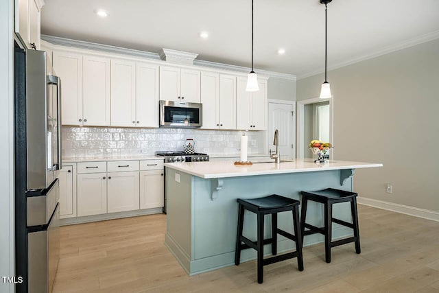83 Vandalia Ave, Chapel Hill, NC 27516 - kitchen with white cabinets, stainless steel appliances, a sink, tasteful backsplash, and light countertops