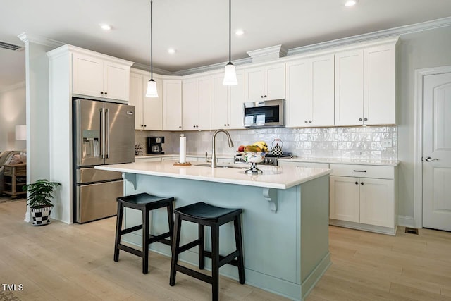 83 Vandalia Ave, Chapel Hill, NC 27516 - kitchen with stainless steel appliances, light countertops, a sink, and crown molding