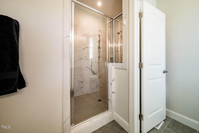 83 Vandalia Ave, Chapel Hill, NC 27516 - bathroom with baseboards and a marble finish shower