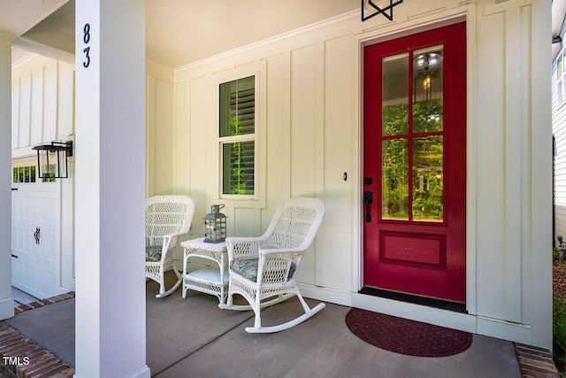 83 Vandalia Ave, Chapel Hill, NC 27516 - doorway to property with board and batten siding and a porch