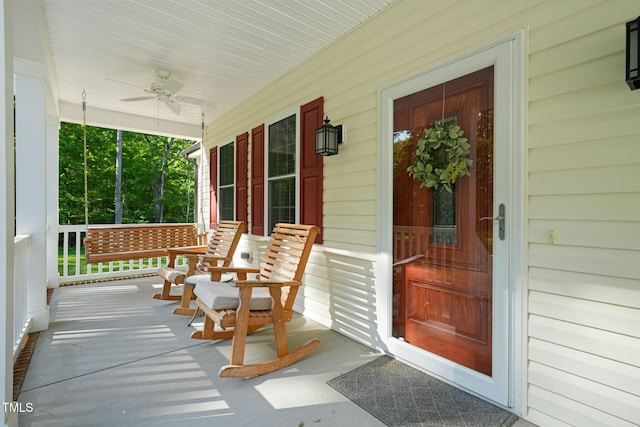 exterior space with a porch and ceiling fan