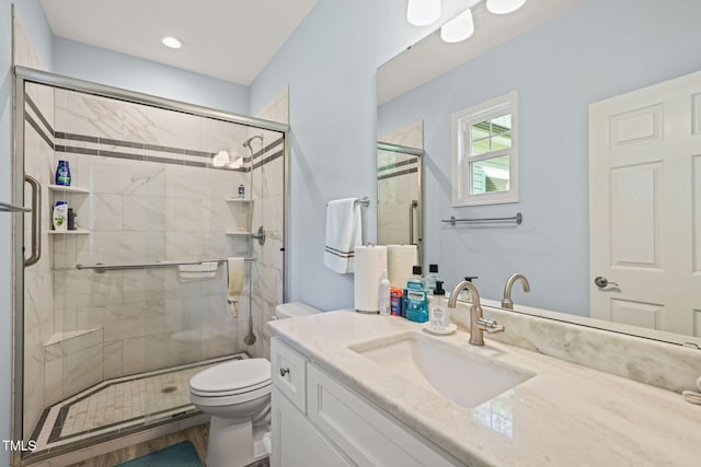 full bathroom with toilet, recessed lighting, a shower stall, and vanity