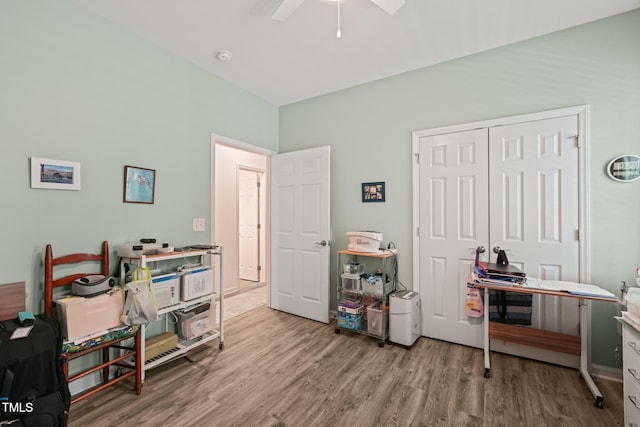 office area with a ceiling fan and wood finished floors