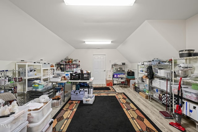 office space featuring wood finished floors and vaulted ceiling