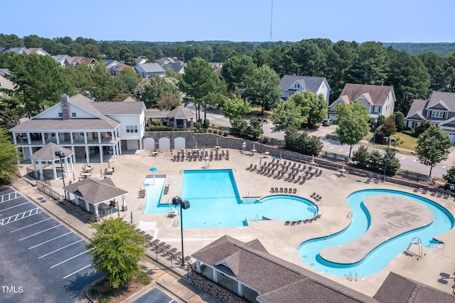 aerial view of residential area featuring a pool area