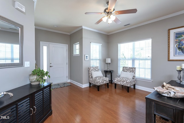 3827 Heritage Spring Cir, Wake Forest, NC 27587 - entryway featuring wood finished floors, plenty of natural light, and crown molding