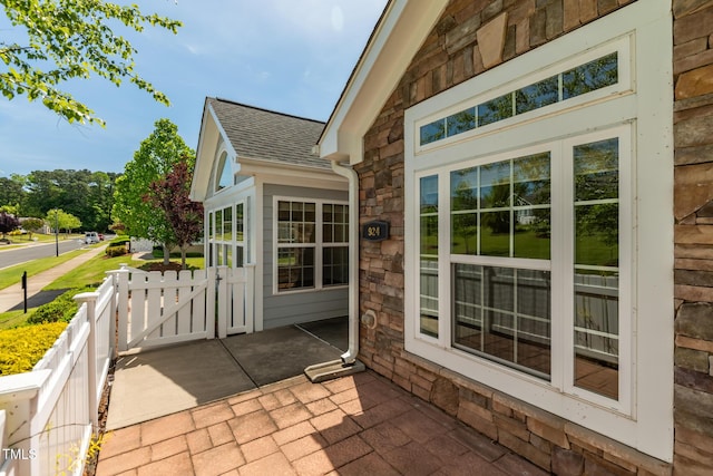 view of patio / terrace featuring a gate and fence