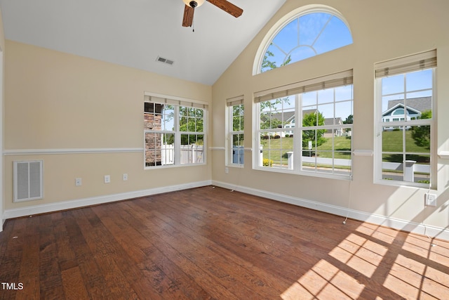 empty room featuring high vaulted ceiling, baseboards, ceiling fan, and hardwood / wood-style floors