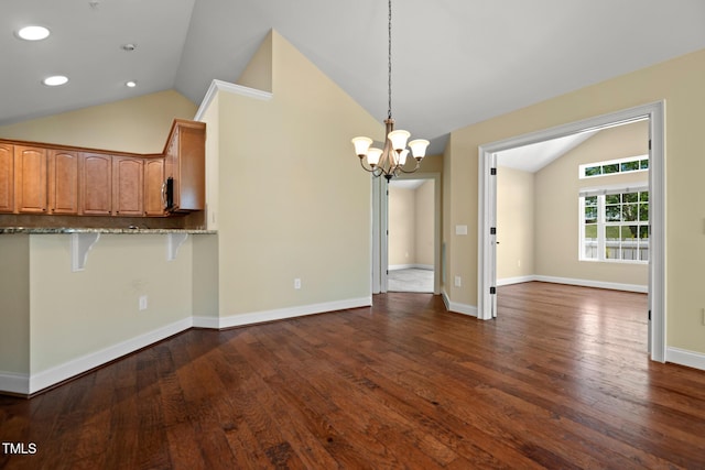 unfurnished dining area with lofted ceiling, a chandelier, dark wood-style flooring, recessed lighting, and baseboards