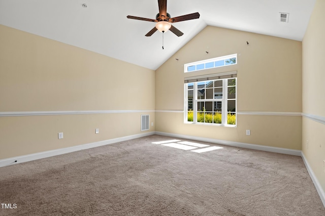 carpeted spare room featuring a ceiling fan, baseboards, and high vaulted ceiling