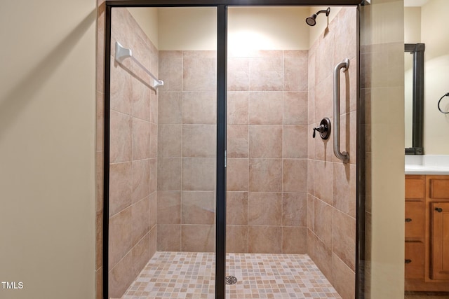 bathroom with a stall shower and vanity