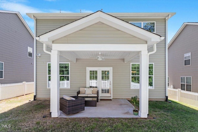 rear view of house featuring a fenced backyard, a patio, ceiling fan, and a yard