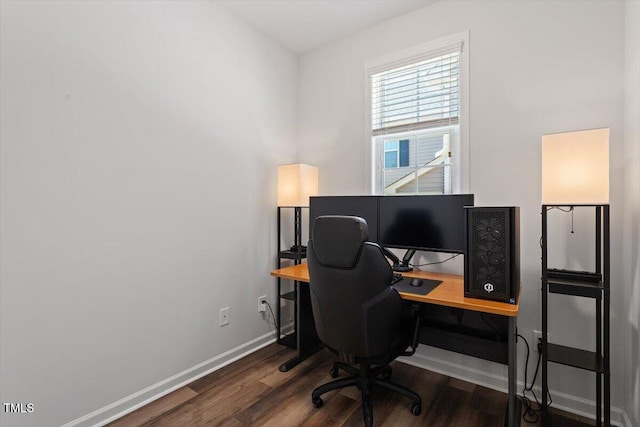office space with baseboards and wood finished floors