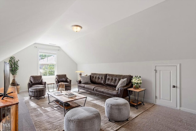 carpeted living room featuring baseboards and lofted ceiling