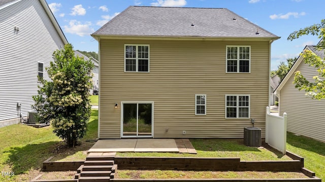125 Occidental Dr, Holly Springs, NC 27540 - back of house with a patio area, a lawn, and central AC