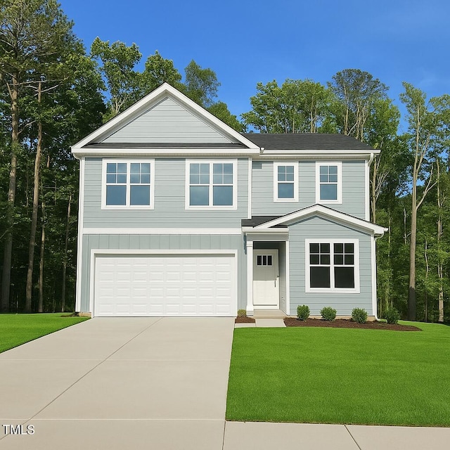 view of front of home featuring a garage, board and batten siding, driveway, and a front lawn