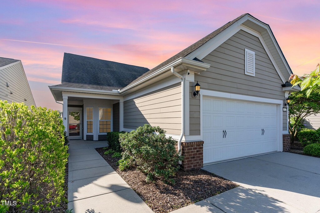 1522 Palmer Hill Dr, Durham, NC 27703 - ranch-style house with brick siding, a shingled roof, and driveway