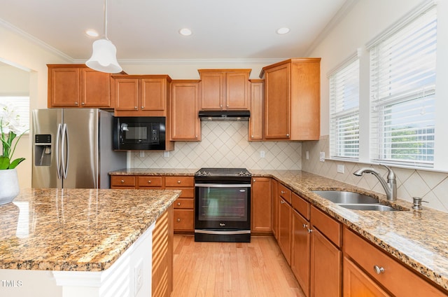 1522 Palmer Hill Dr, Durham, NC 27703 - kitchen with a sink, light wood-style flooring, under cabinet range hood, ornamental molding, and black appliances