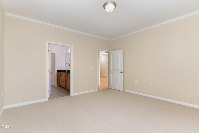 1522 Palmer Hill Dr, Durham, NC 27703 - unfurnished bedroom with connected bathroom, baseboards, ornamental molding, and light carpet