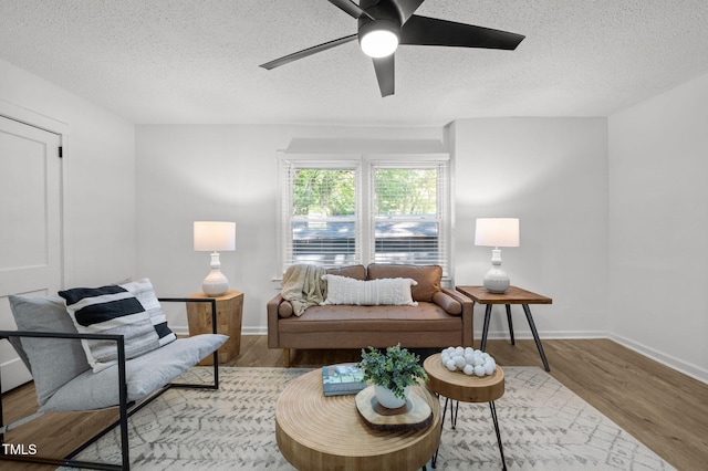 1613 Kilmer Ter, Durham, NC 27703 - living area with baseboards, a textured ceiling, ceiling fan, and wood finished floors
