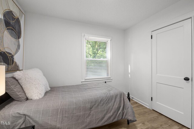 1613 Kilmer Ter, Durham, NC 27703 - bedroom with wood finished floors