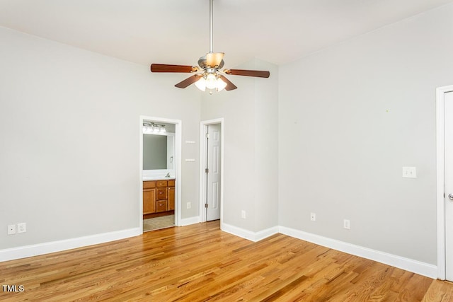 305 Freeman St, Raleigh, NC 27601 - empty room with light wood-style flooring, ceiling fan, baseboards, and vaulted ceiling