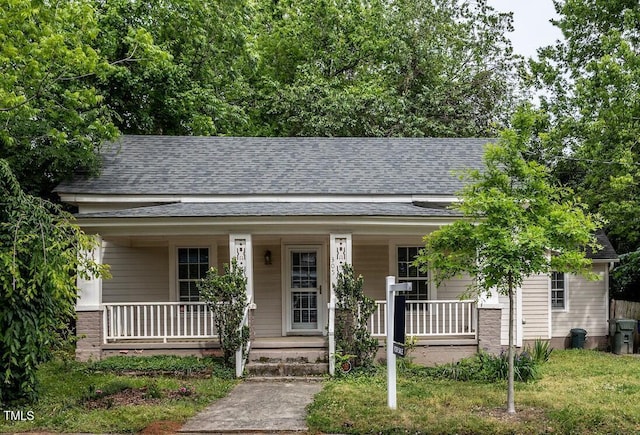 305 Freeman St, Raleigh, NC 27601 - bungalow-style home with covered porch and a shingled roof