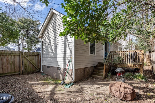 305 Freeman St, Raleigh, NC 27601 - view of home's exterior featuring crawl space, a deck, a gate, and fence