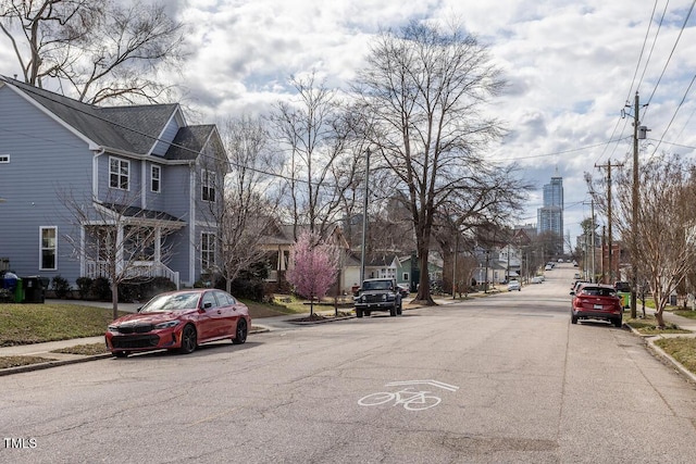 305 Freeman St, Raleigh, NC 27601 - view of asphalt road with curbs, sidewalks, and a residential view