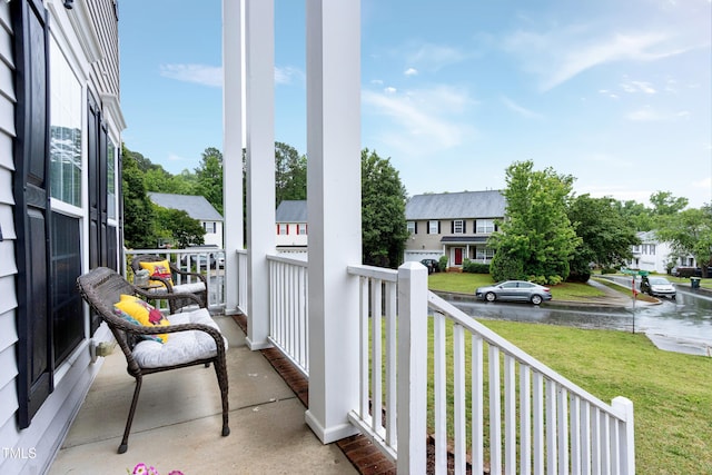 balcony featuring a residential view and a porch