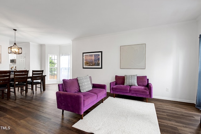 living area featuring dark wood-style floors, crown molding, and baseboards