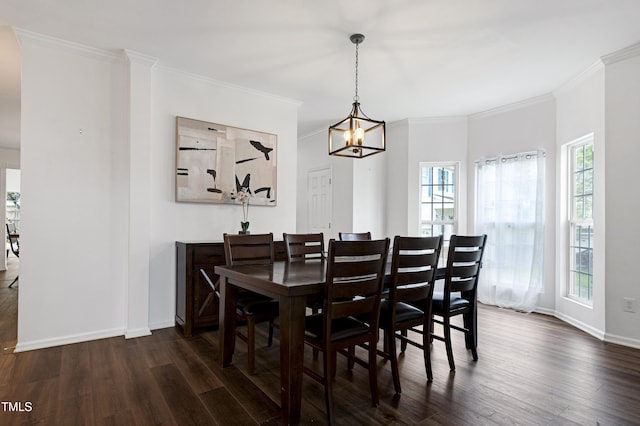 dining area featuring dark wood-style flooring, a chandelier, baseboards, and ornamental molding