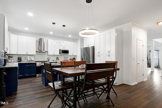dining area with dark wood-style flooring, recessed lighting, and baseboards