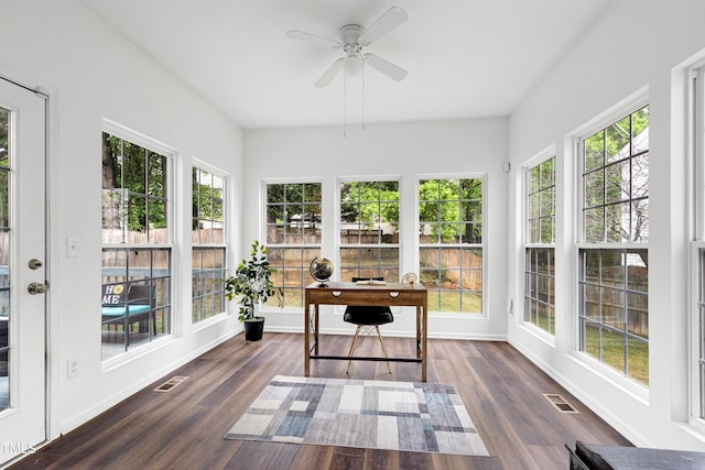 sunroom / solarium with wood finished floors and baseboards