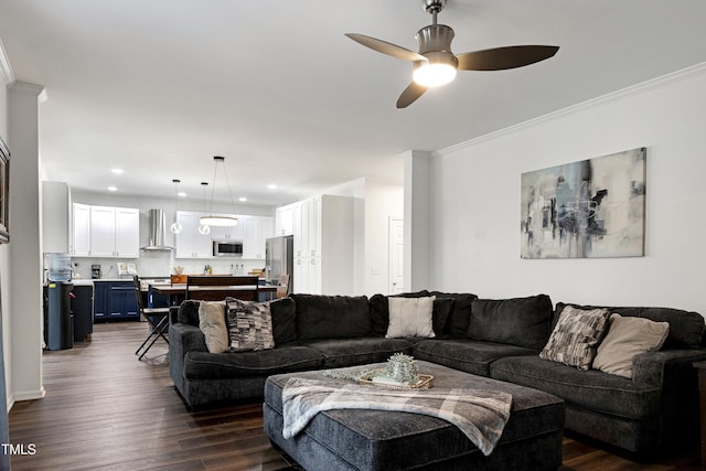 living area featuring dark wood finished floors, ornamental molding, a ceiling fan, and recessed lighting