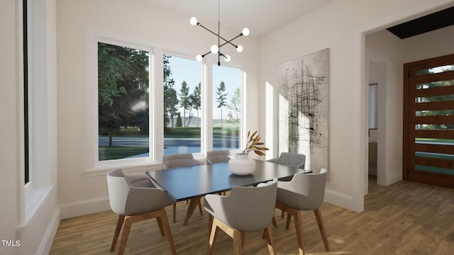 1800 Pershing Rd, Raleigh, NC 27608 - dining room with wood finished floors, a chandelier, and baseboards