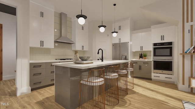 1800 Pershing Rd, Raleigh, NC 27608 - kitchen with wall chimney range hood, appliances with stainless steel finishes, light wood finished floors, and tasteful backsplash