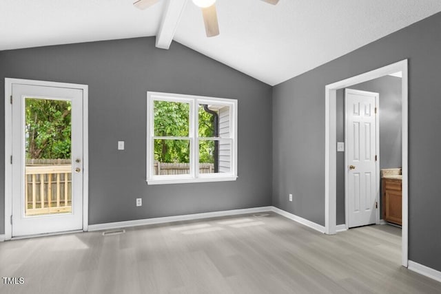 2402 Cynthia Dr, Durham, NC 27704 - interior space with light wood-style floors, access to exterior, vaulted ceiling with beams, and multiple windows
