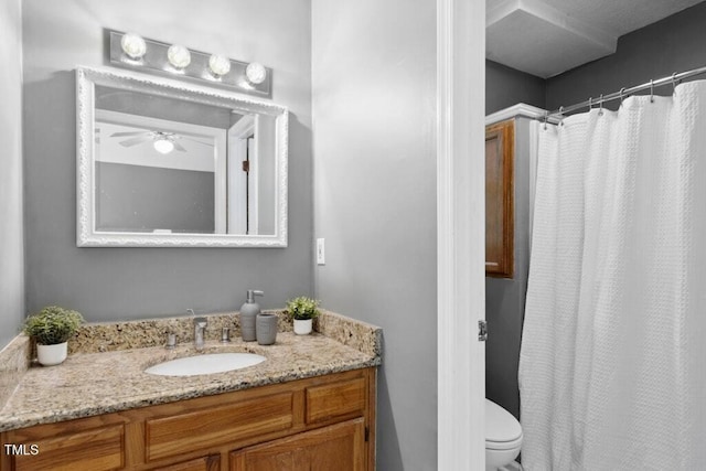 2402 Cynthia Dr, Durham, NC 27704 - bathroom featuring toilet, vanity, ceiling fan, and a shower with curtain