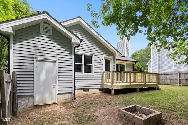 2402 Cynthia Dr, Durham, NC 27704 - back of property featuring a fenced backyard, a fire pit, a wooden deck, a yard, and crawl space