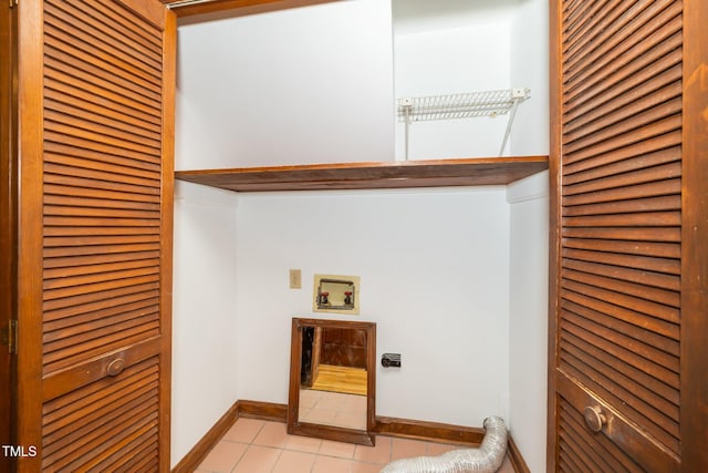 5800 Heatherbrook Cir, Raleigh, NC 27612 - laundry area featuring light tile patterned flooring, hookup for a washing machine, baseboards, electric dryer hookup, and a heating unit