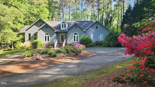 113 Colonial Dr, Wendell, NC 27591 - view of front of property with aphalt driveway and a chimney