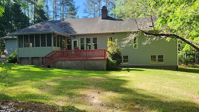 113 Colonial Dr, Wendell, NC 27591 - rear view of property featuring a chimney, a deck, a sunroom, and a lawn
