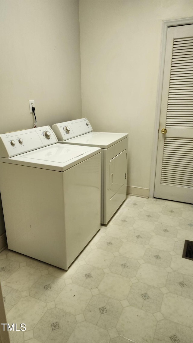 113 Colonial Dr, Wendell, NC 27591 - laundry room featuring laundry area, washer and clothes dryer, light floors, and baseboards