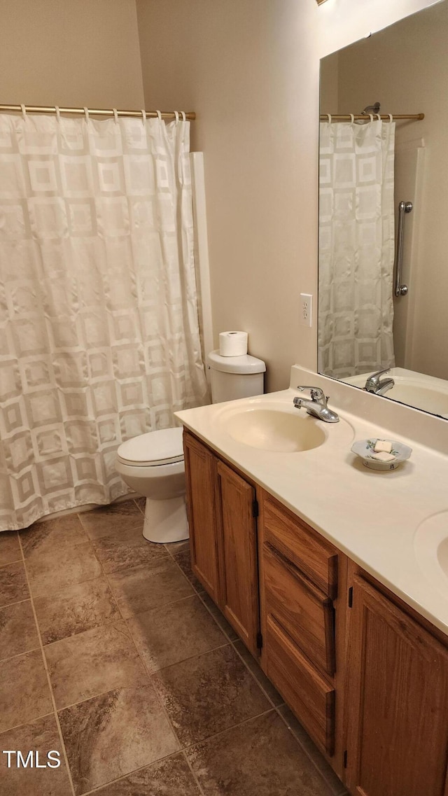 113 Colonial Dr, Wendell, NC 27591 - full bath featuring toilet, double vanity, and a sink