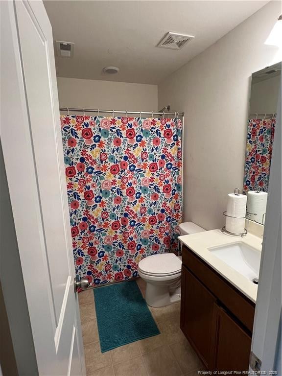 bathroom featuring curtained shower, tile patterned flooring, visible vents, toilet, and vanity