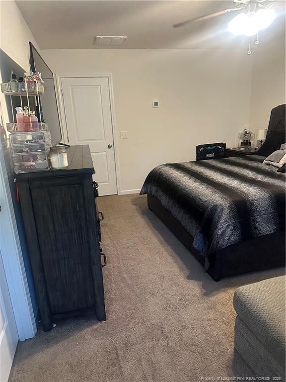 carpeted bedroom featuring baseboards