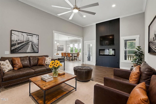 8629 Dukes Lake Rd, Zebulon, NC 27597 - living room featuring light wood-style flooring, a ceiling fan, crown molding, and recessed lighting