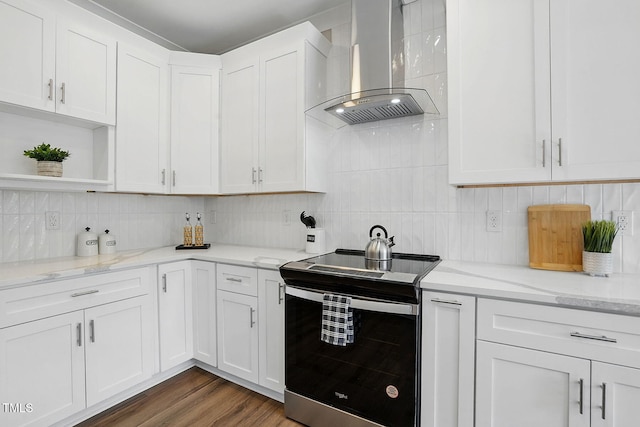 8629 Dukes Lake Rd, Zebulon, NC 27597 - kitchen with stainless steel range with electric cooktop, ventilation hood, open shelves, white cabinets, and tasteful backsplash